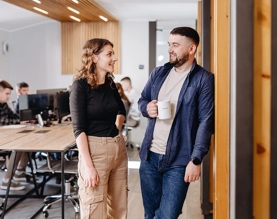 Colleagues talking in the SapientPro office